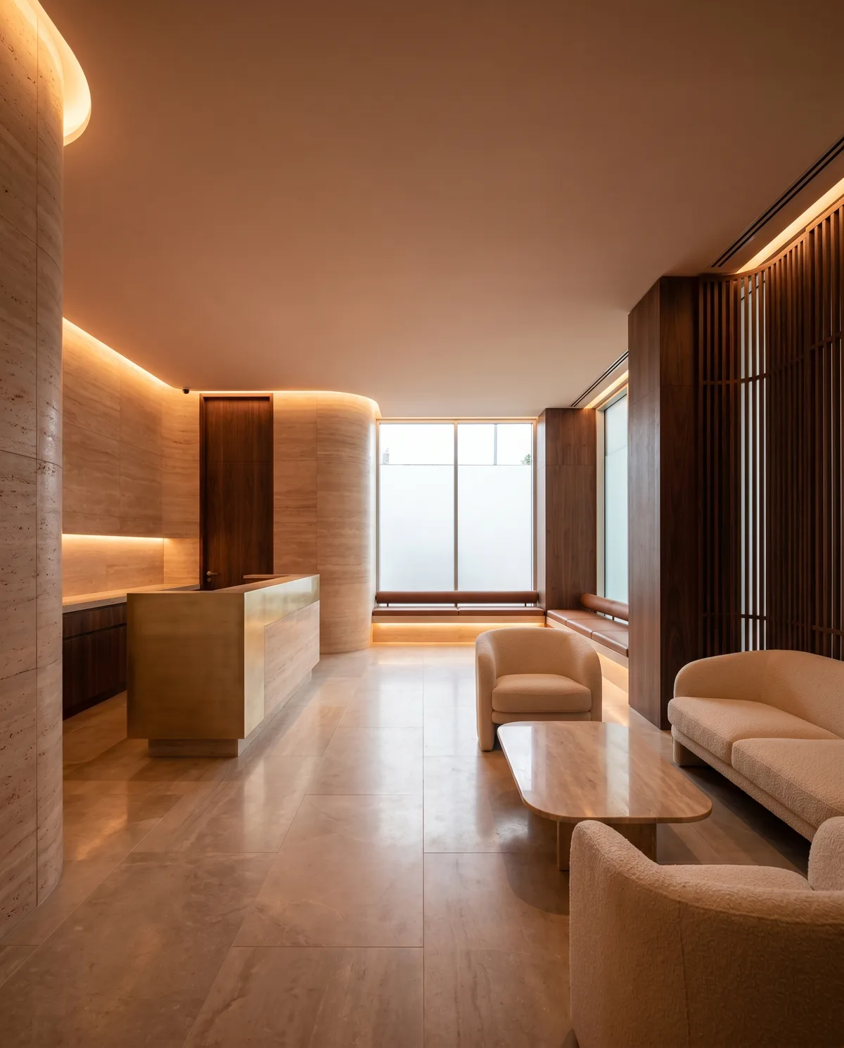 Medical clinic reception in warm travertine and walnut